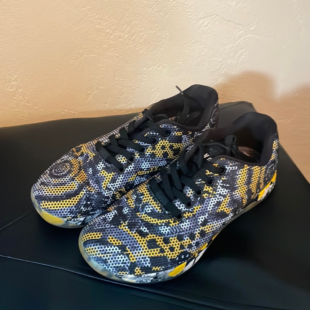 Size 7.5 women’s NOBULL shoes. Black, white, and yellow. Used a few times